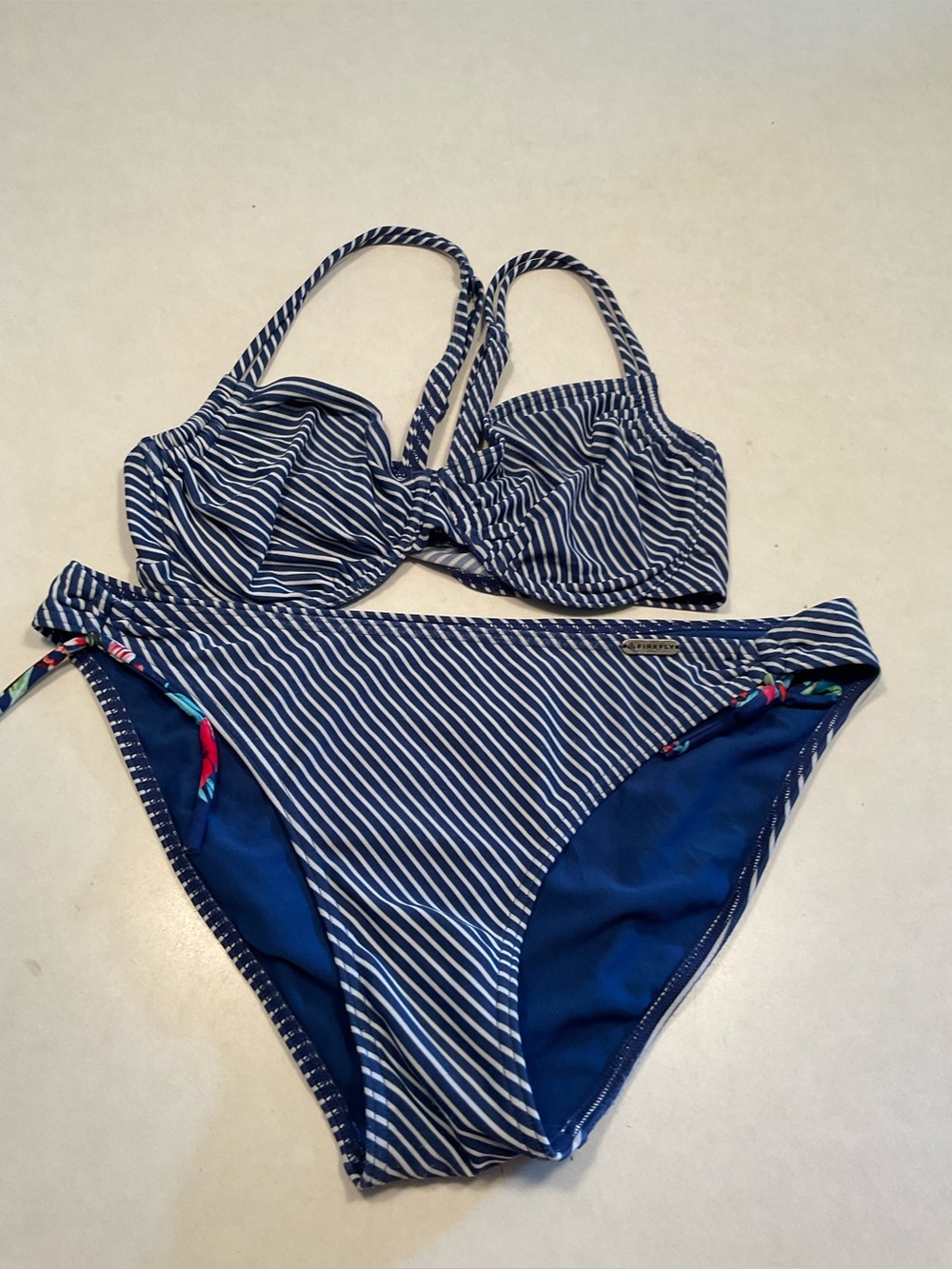 navy blue and white striped two-piece bikini set by the swimwear brand Firefly.
